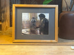 Natural Frame w/ A Print Of A Lady In A Room At A Table